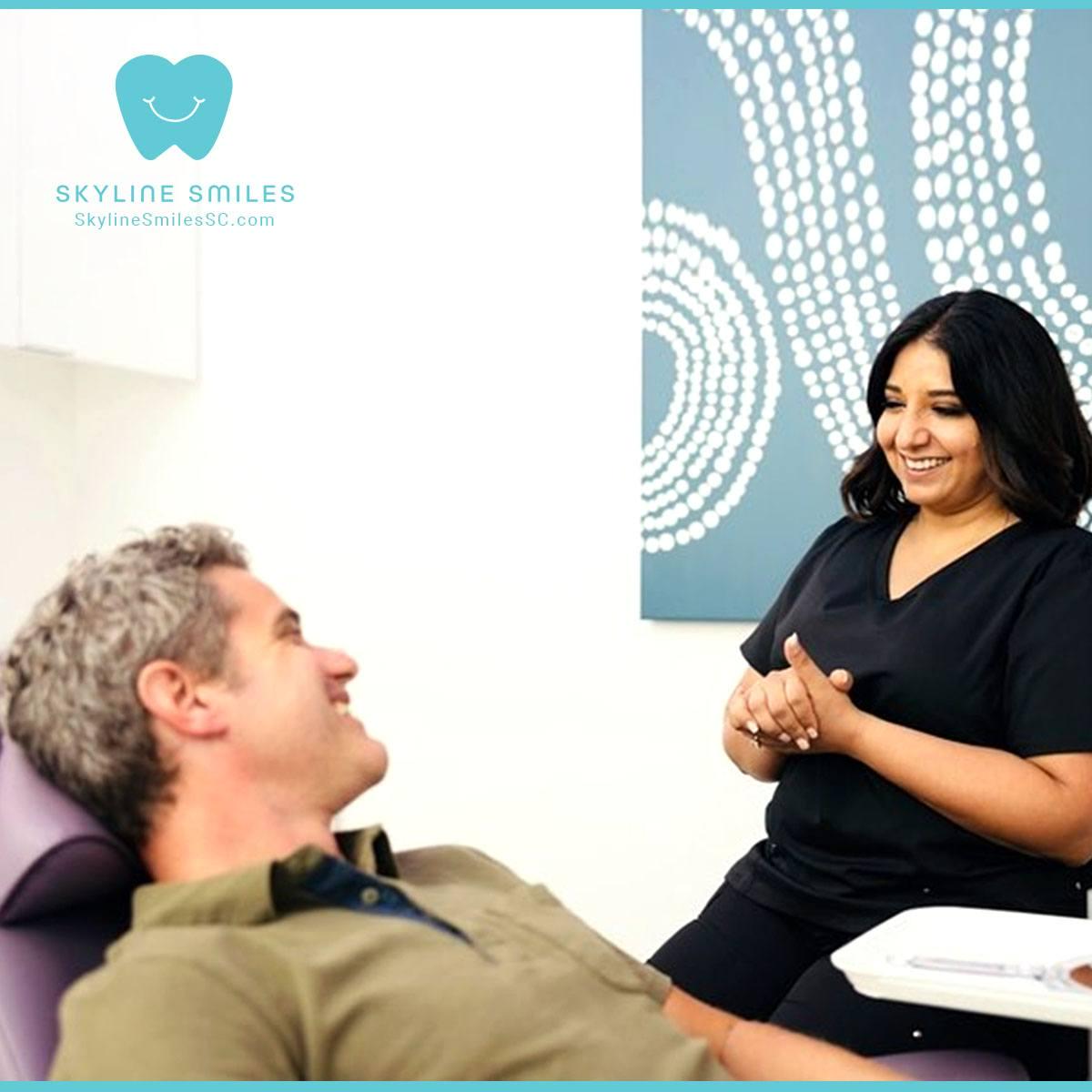 Dentist with happy patient